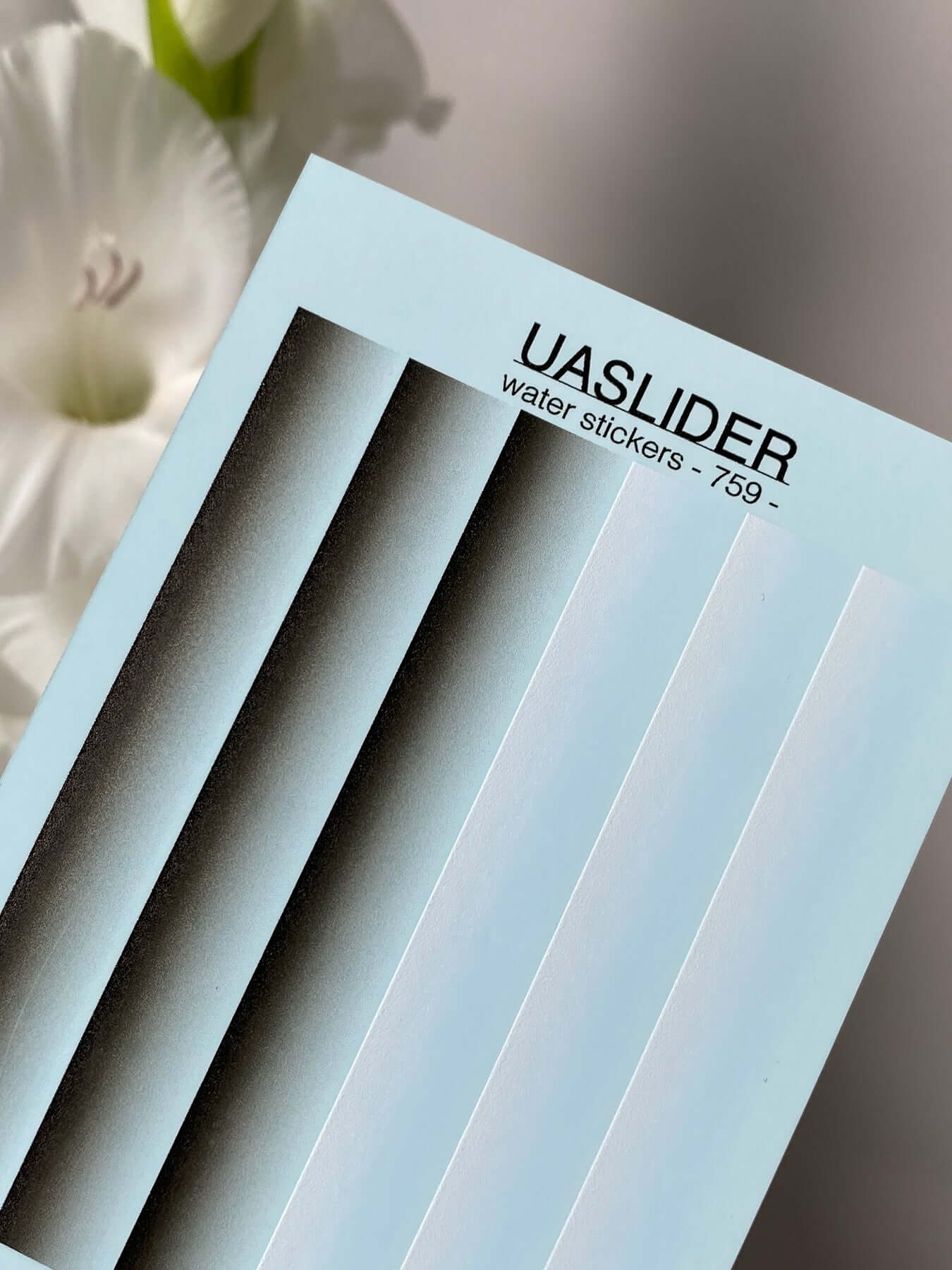 Nail Water Decal 759 on display, featuring water slide nail decals with a white backing for vibrant designs.