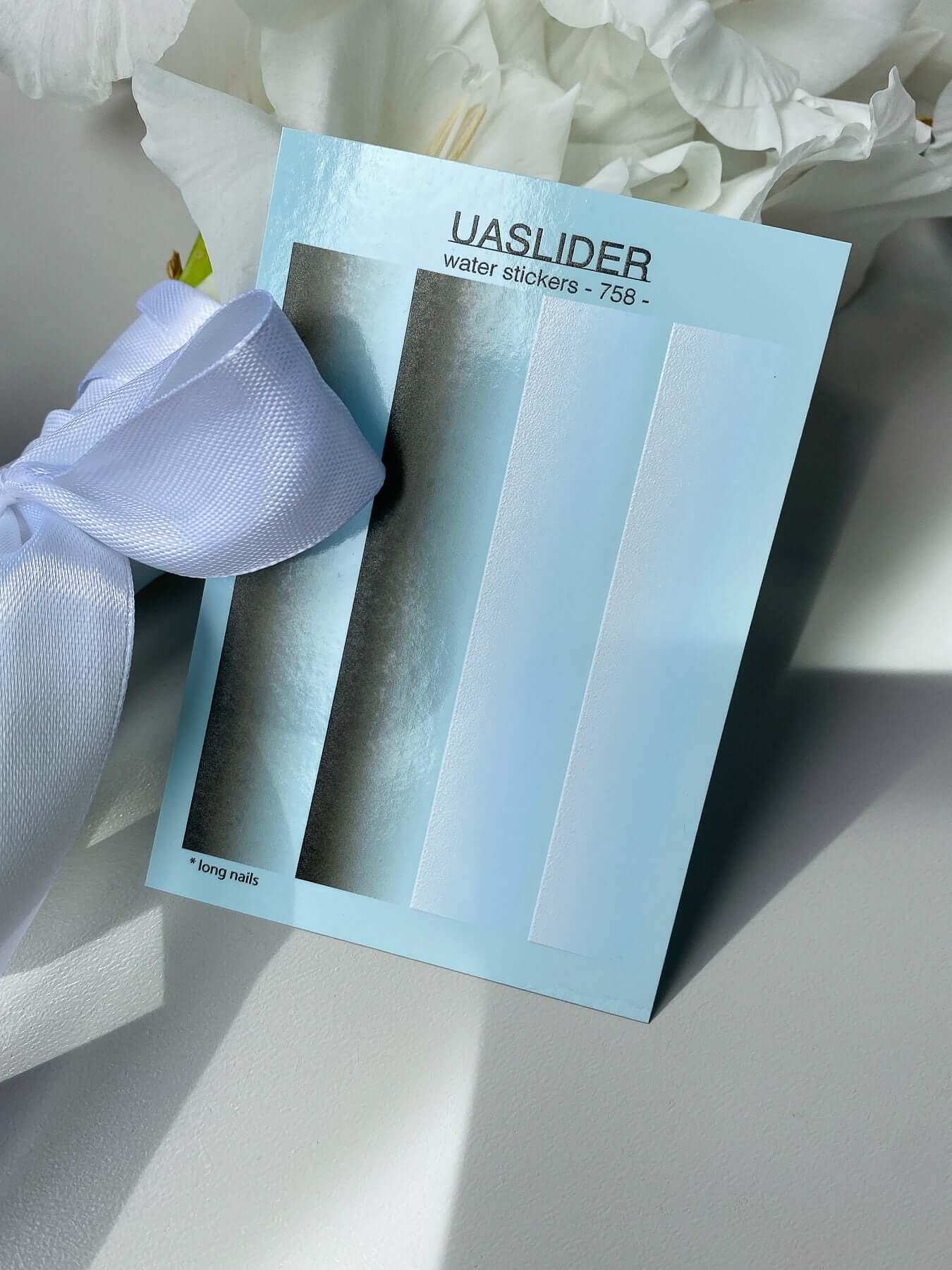 Nail Water Decal 758 packaging with water slide decals and ribbon detail on a clean surface.