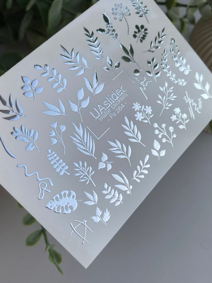 Köröm víz matrica Fs-264 | Botanikus vízcsúsztatós köröm matricák | Ezüst fólia levelek és virágos ágvégek