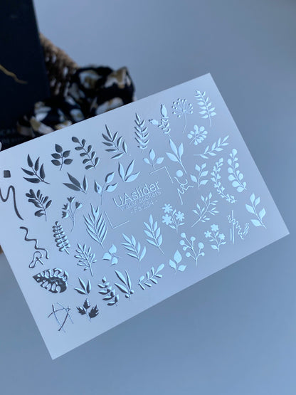 Köröm víz matrica Fs-264 | Botanikus vízcsúsztatós köröm matricák | Ezüst fólia levelek és virágos ágvégek