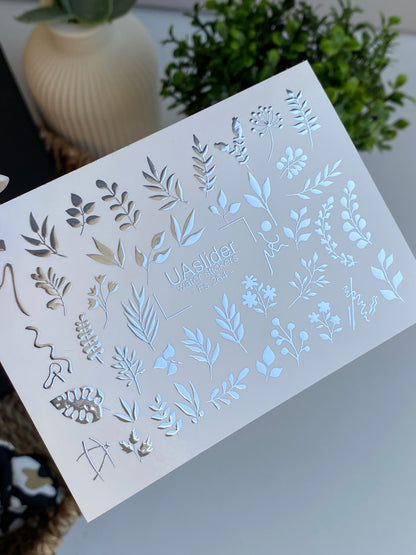 Köröm víz matrica Fs-264 | Botanikus vízcsúsztatós köröm matricák | Ezüst fólia levelek és virágos ágvégek