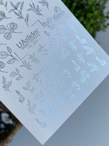 Köröm víz matrica Fs-266 | Botanikus vízcsúsztatós köröm matricák | Ezüst fólia levelek és ágak