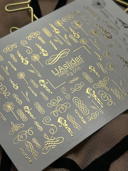 Naklejki na paznokcie wodne Fg-016 | Eleganckie wodne naklejki na paznokcie z złotą folią | Zawijasy i ozdoby kaligraficzne